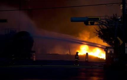 A fire keeps burns after railway cars that were carrying crude oil derailed in downtown Lac Megantic, Quebec, Saturday, July 6, 2013. (AP Photo/The Canadian Press, Paul Chiasson)