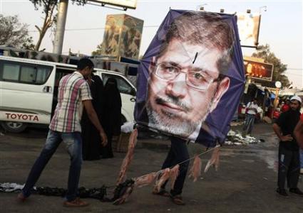 Supporters of deposed Egyptian President Mursi fly a kite in the sit-in area of Rab'a al- Adawiya Square