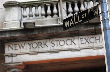 A Wall Street sign is seen in front of the New York Stock Exchange in New York's financial district