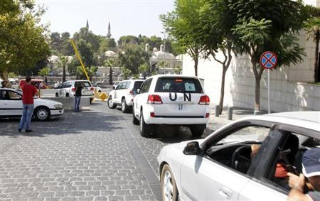 U.N. vehicles transport a team of U.N. chemical weapons experts to the scene of a poison gas attack outside the Syrian capital last week, in Damascus