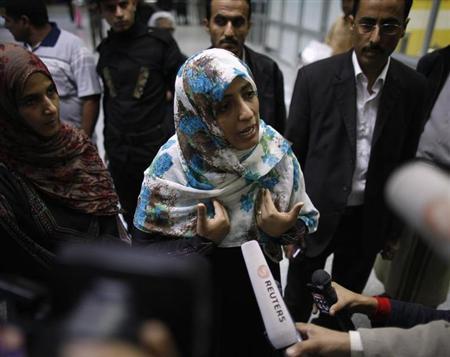 Nobel Peace Prize winner Tawakul Karman of Yemen speaks to reporters at Sanaa International Airport upon her arrival from Egypt August 4, 2013. REUTERS/Khaled Abdullah