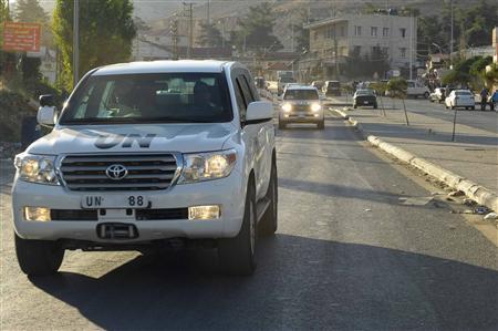 U.N. peacekeeping inspectors leave the Masnaa border crossing between Lebanon and Syria