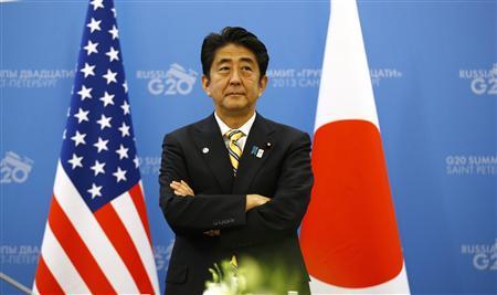 Japanese PM Abe waits for U.S. President Obama to arrive for their meeting at the G20 Summit in St. Petersburg