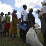 Zimbabwean villagers collect their monthly rations of food aid from Rutaura Primary School in Rushinga district of Mt Darwin about 254km north of Harare