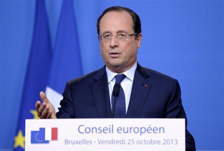 France's President Hollande addresses a news conference at an European Union leaders summit in Brussels