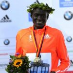 Kimetto of Kenya celebrates during the awards ceremony for the 41st Berlin marathon