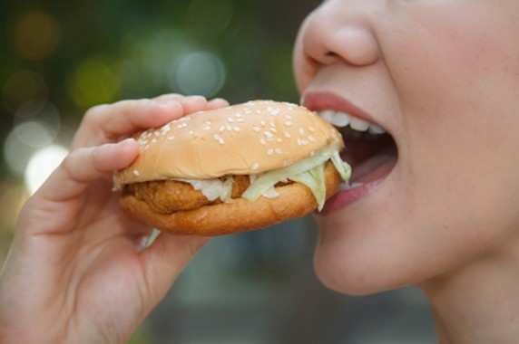 Woman Eating A Hamburger -  by tiverylucky