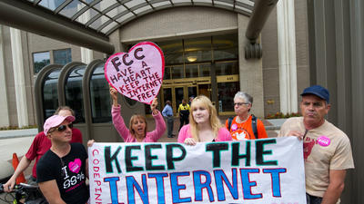 Protesters hold a rally at the Federal Communications Commission