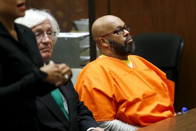 Defendant Marion "Suge" Knight looks on as he attends a hearing with his attorney Thomas Mesereau in his robbery case in Los Angeles, California