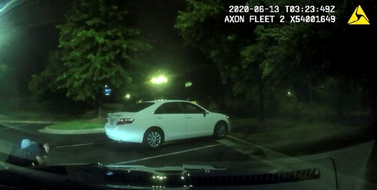 This undated handout photo obtained June 14, 2020, from the Atlanta (Georgia) Police Department shows an image from a video camera of a struggle a day earlier between police officers and suspect Rayshard Brooks (L) |The Atlanta Police Department/AFP / Lizabeth MENZIES