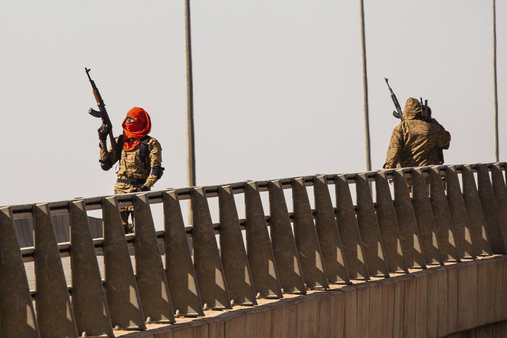 A mutinous soldier fires into the air at the Bobo interchange, near the Lamizana camp in Burkina Faso's capital Ouagadougou 