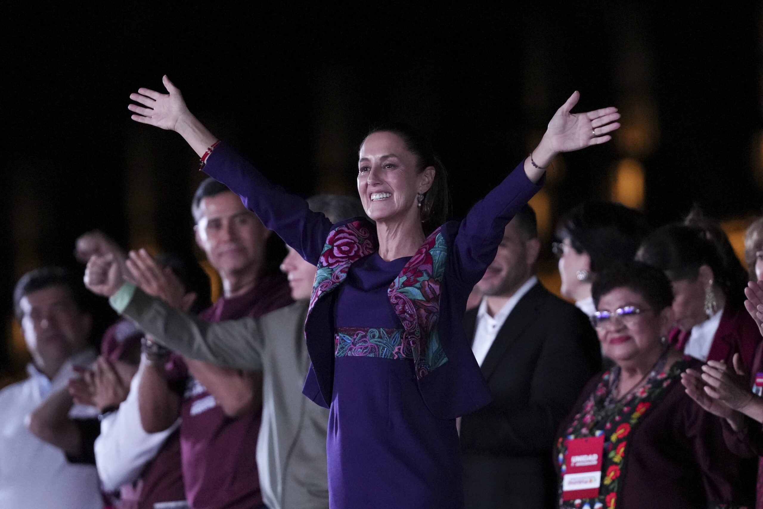 President-elect Claudia Sheinbaum waves to supporters at the Zocalo, Mexico City’s main square, after the National Electoral Institute announced she held an irreversible lead in the election, early Monday, June 3, 2024. (AP Photo/Marco Ugarte)