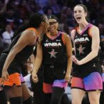 Caitlin Clark, right, Allisha Gray, center, and Aliyah Boston, left, of Team WNBA