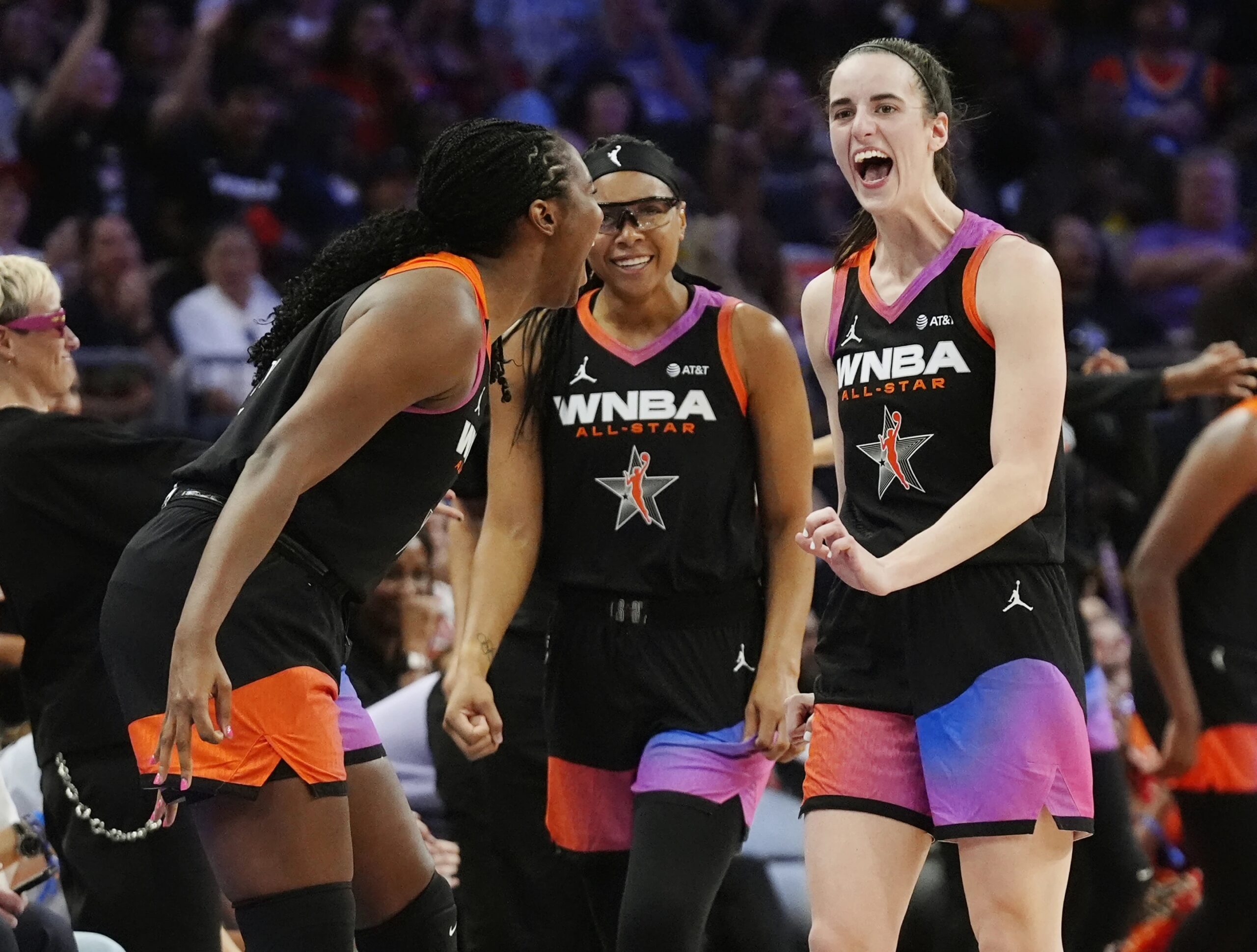 Caitlin Clark, right, Allisha Gray, center, and Aliyah Boston, left, of Team WNBA