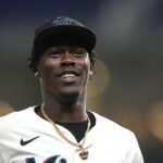 Miami Marlins’ Jazz Chisholm Jr. walks from the field to the dugout during the seventh inning of a baseball game against the New York Mets