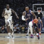 United States’ forward LeBron James runs as he advances to score as South Sudan’s center Khaman Maluach