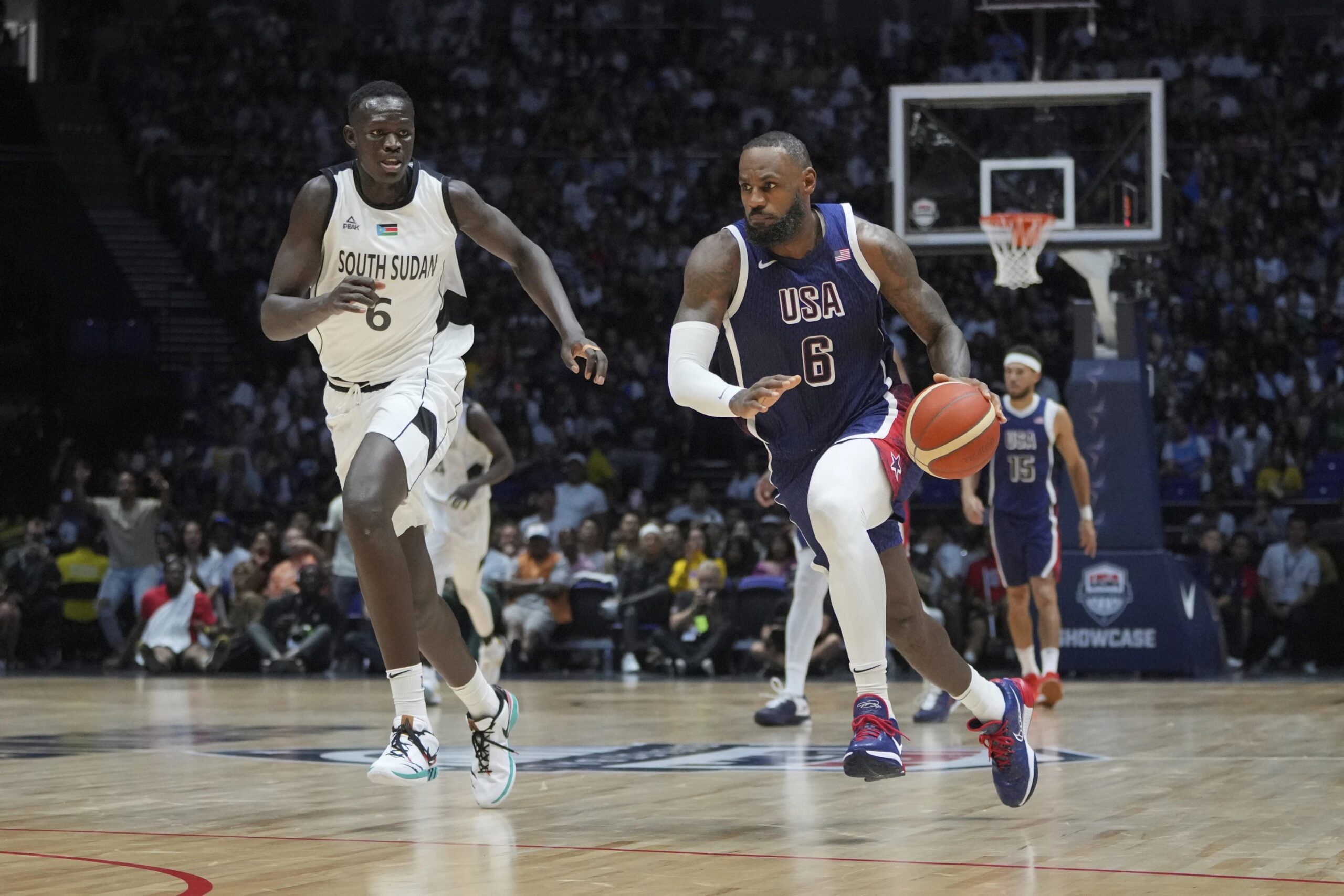 LeBron James runs as he advances to score as South Sudan’s center Khaman Maluach