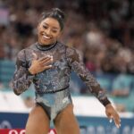 Simone Biles competes on the balance beam during a women’s artistic gymnastics qualification round at the 2024 Summer Olympics at Bercy Arena