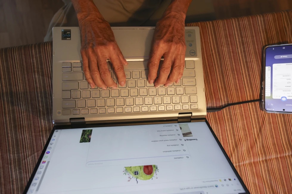 Barbara Winston uses a computer at her home in Northbrook