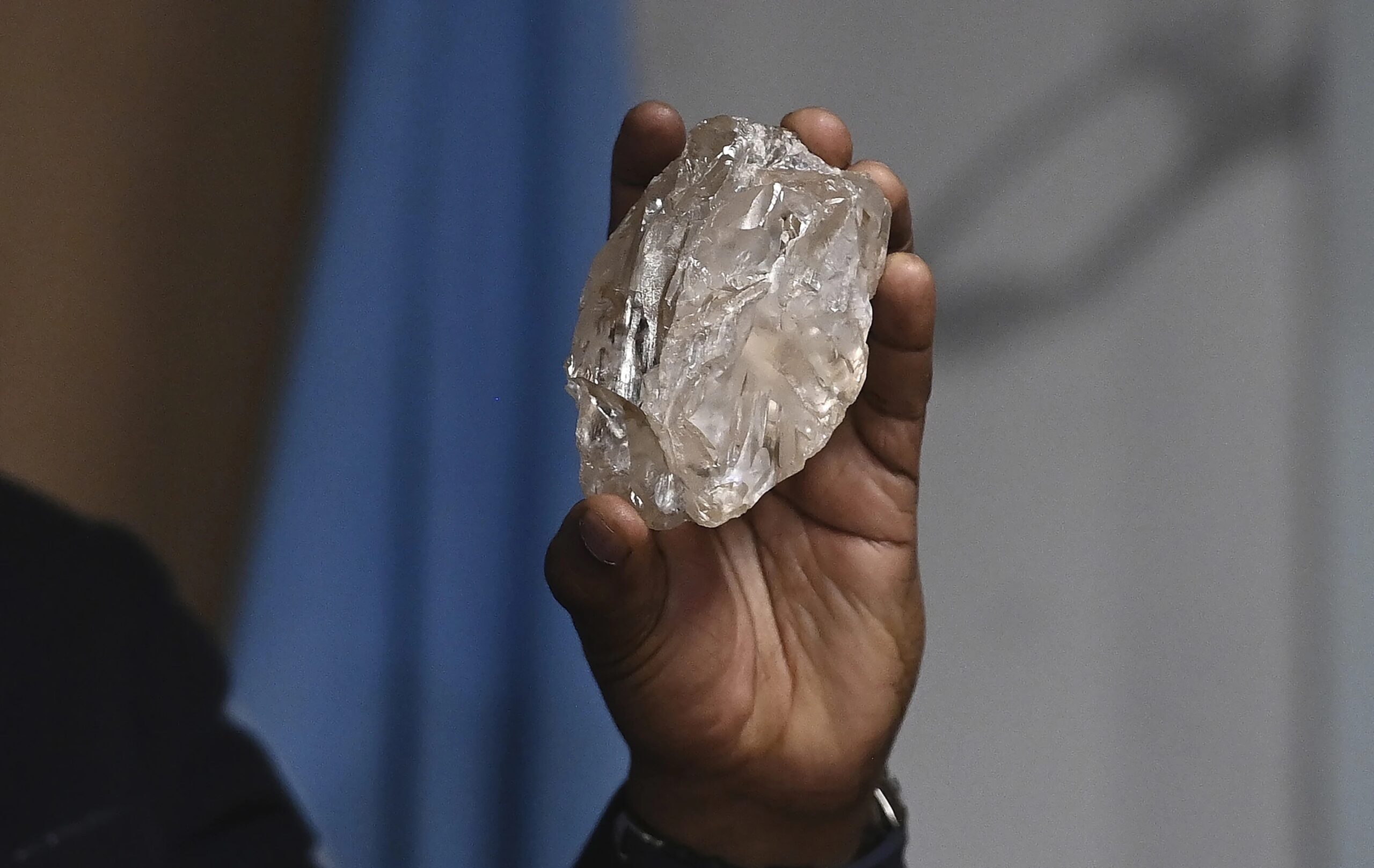 A person holds a 2,492-carat diamond which was found in the country and on show, in Gaborone, Botswana, Thursday, Aug. 22, 2024. 