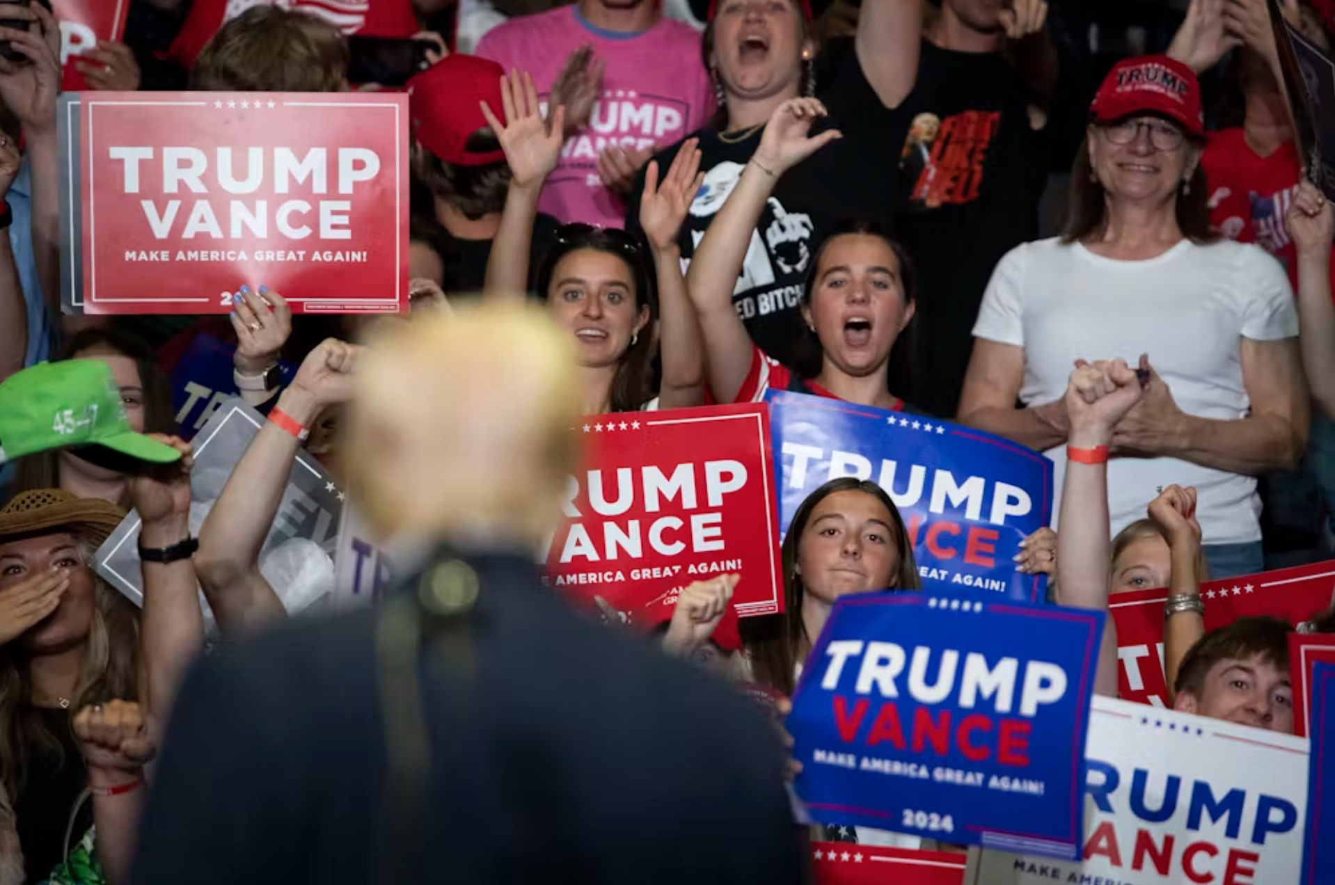 Donald Trump looks to young supporters as he holds a rally in Grand Rapids, Mich., on July 20, 2024. 