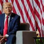 Republican presidential nominee and former U.S. President Donald Trump smiles while speaking on a panel of the National Association of Black Journalists (NABJ) convention in Chicago, Illinois, U.S. July 31, 2024.