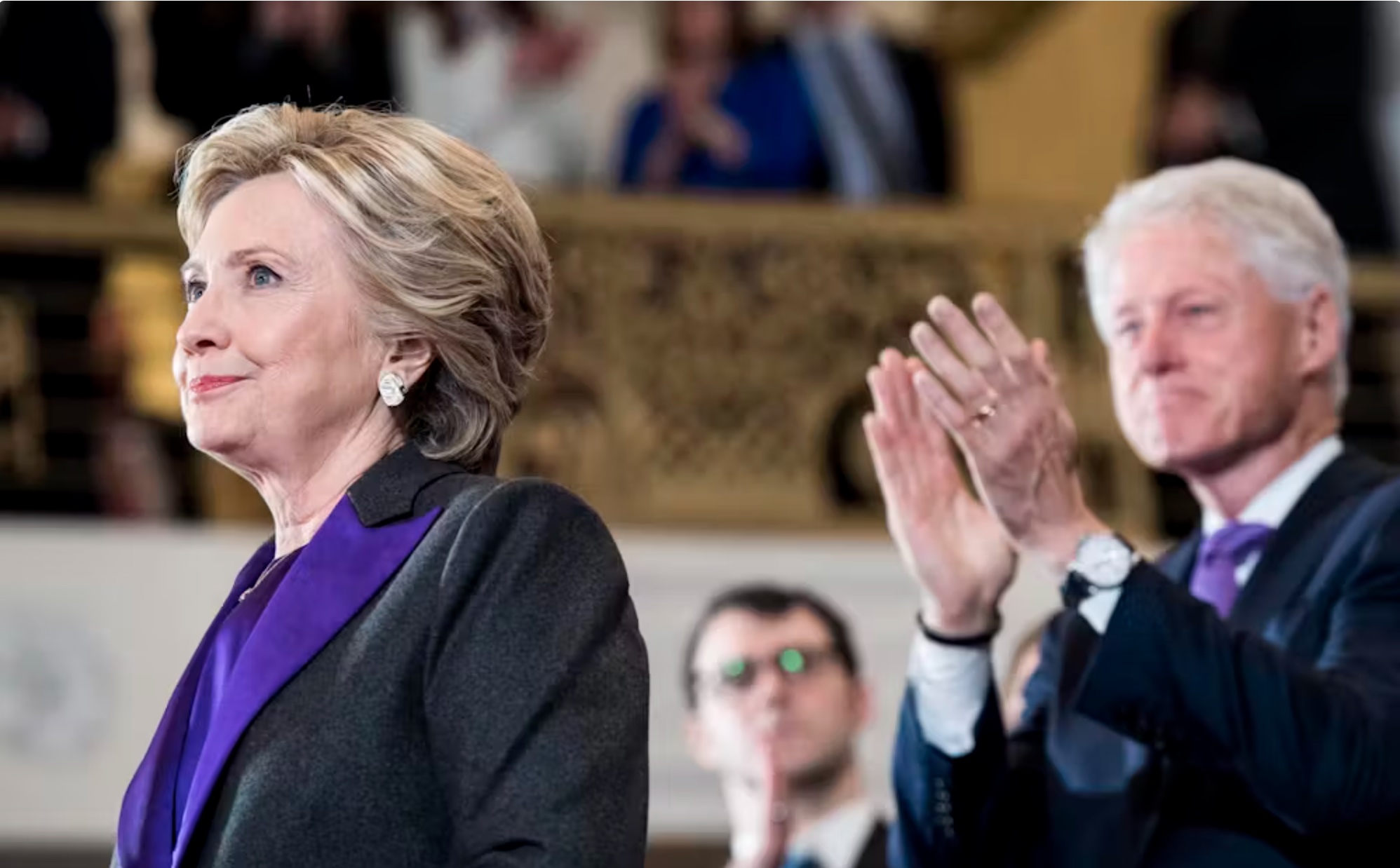 The morning after losing the election to Republican Donald Trump, Democrat Hillary Clinton, accompanied by former President Bill Clinton, speaks to supporters and campaign staff on Nov. 9, 2016. 