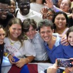 Kamala Harris takes a photo with young supporters at a rally at Temple University in Philadelphia, Penn., on Aug. 6, 2024.