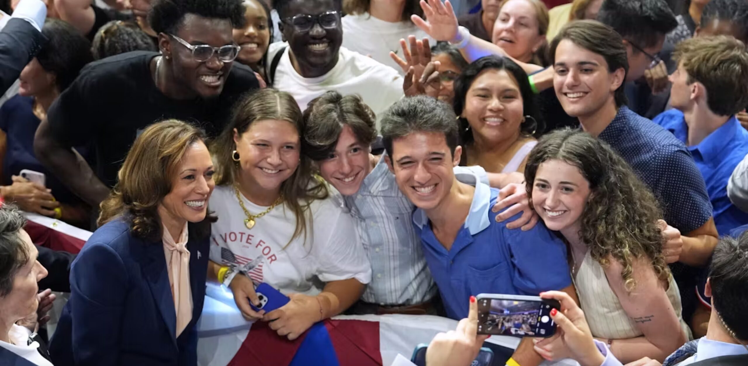 Kamala Harris takes a photo with young supporters at a rally at Temple University in Philadelphia, Penn., on Aug. 6, 2024. 