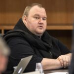 German tech entrepreneur Kim Dotcom sits in a chair during a court hearing in Auckland, New Zealand, September 24, 2015.