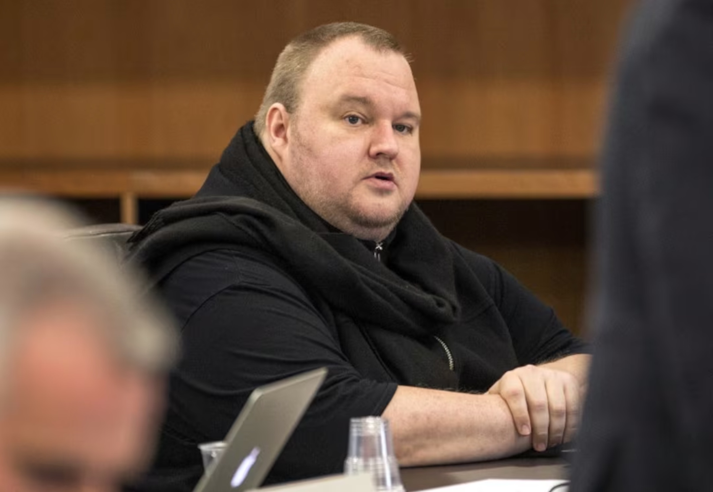 German tech entrepreneur Kim Dotcom sits in a chair during a court hearing in Auckland, New Zealand, September 24, 2015.