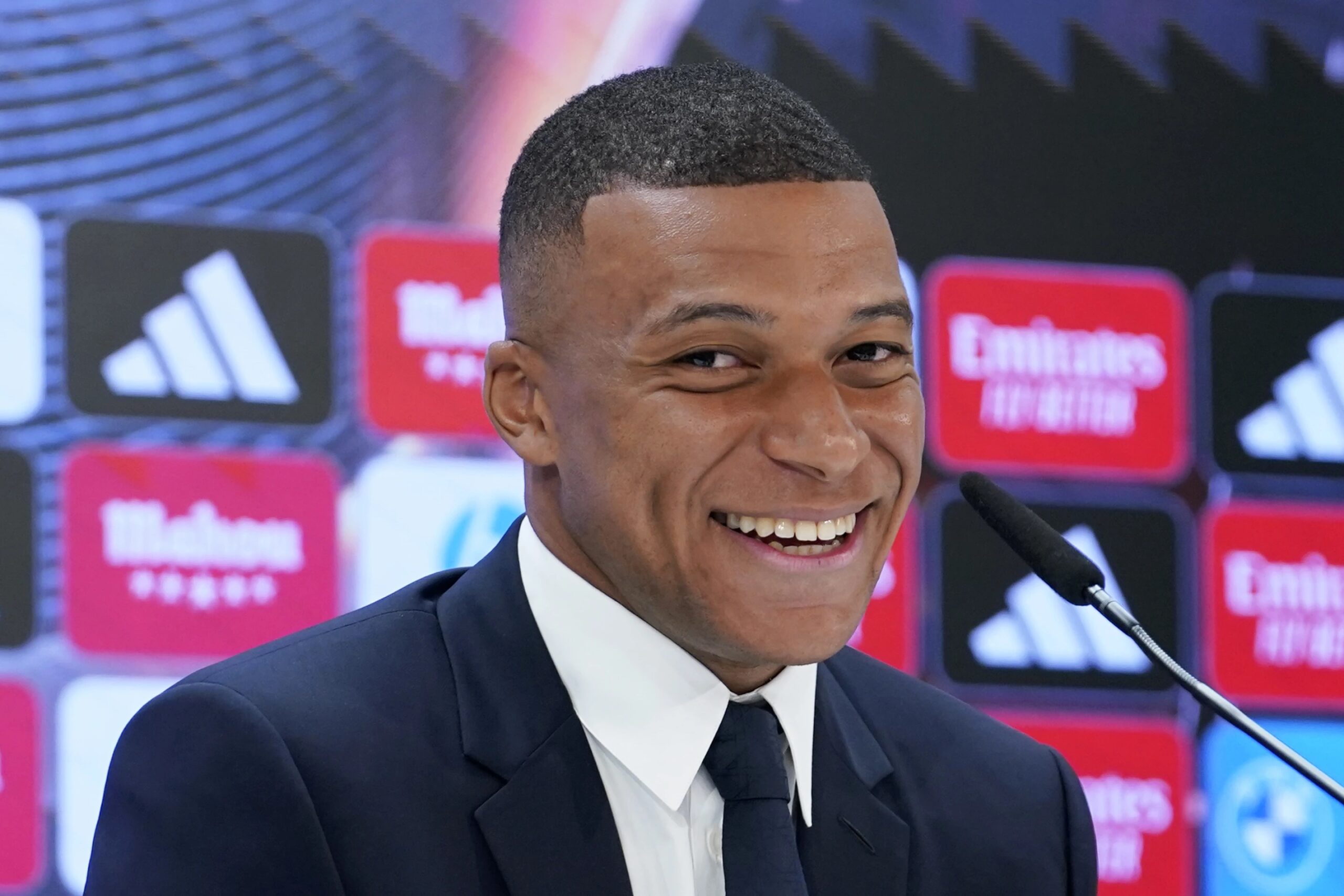 Kylian Mbappe, of France, smiles during a news conference after being presented to fans as a new Real Madrid player at the Santiago Bernabeu stadium in Madrid, Tuesday, July 16, 2024.