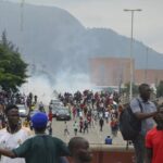 Police fired tear gas during a protest in Abuja, Nigeria, Thursday, Aug. 1, 2024. Thousands of mostly young people poured onto the streets across Nigeria on Thursday as they protested against the country’s worst cost-of-living crisis in a generation. Security forces fired tear gas to disperse some of the protesters in the capital, Abuja.