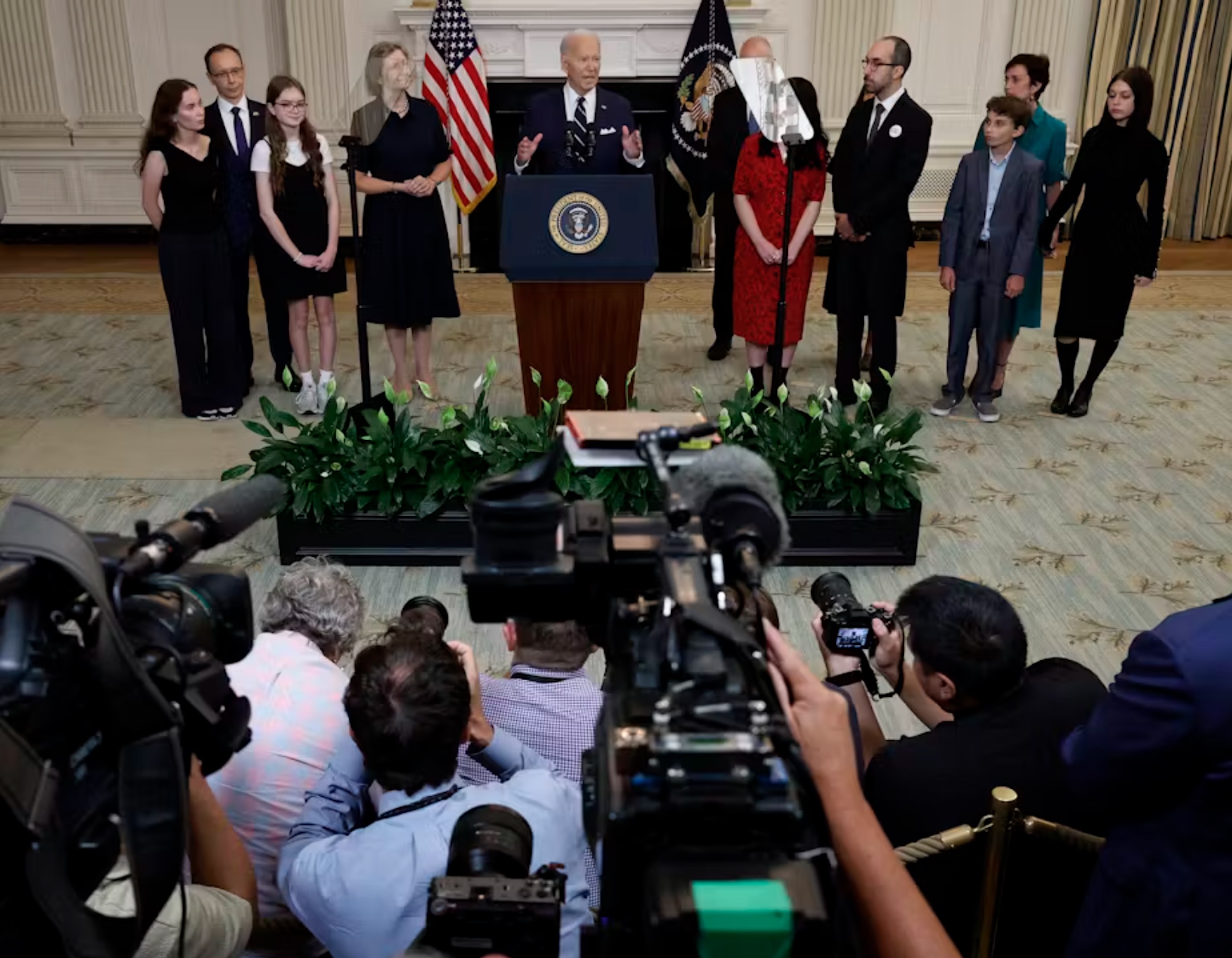 President Joe Biden, joined by relatives of prisoners freed by Russia, delivers remarks about the prisoner swap on Aug. 1, 2024. 