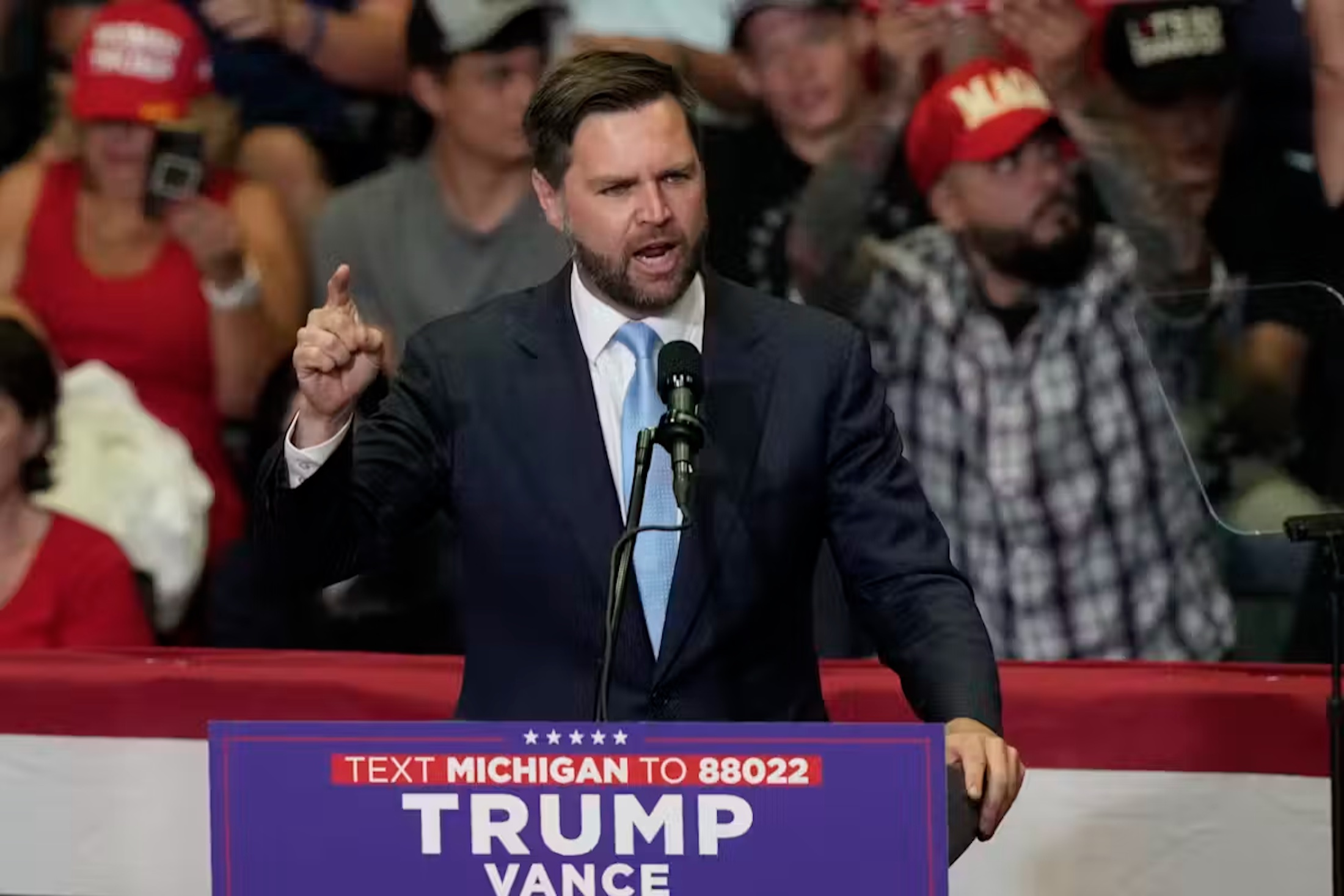 Republican vice-presidential candidate Sen. JD Vance, R-Ohio, speaks at a campaign event with Republican presidential candidate former President Donald Trump, on July 20, 2024, in Grand Rapids, Mich. 