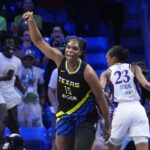 Dallas Wings center Teaira McCowan (15) reacts after scoring the go ahead basket against Los Angeles Sparks forward Azura Stevens (23) during the fourth quarter of a WNBA basketball game in Arlington, Texas, Sunday, Aug. 25, 2024,