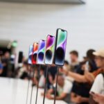 Guests look at the new iPhone 14 at an Apple event at their headquarters in Cupertino, California