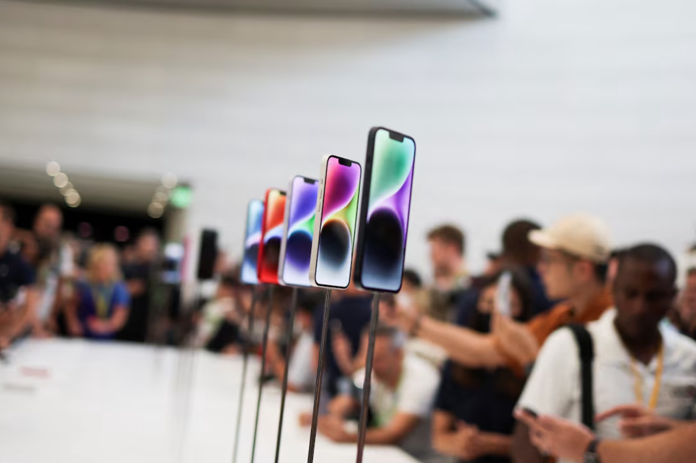 Guests look at the new iPhone 14 at an Apple event at their headquarters in Cupertino, California,