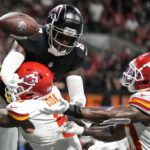 Atlanta Falcons tight end Kyle Pitts (8) misses the catch against Kansas City Chiefs safety Bryan Cook (6) during the second half of an NFL football game, Sunday, Sept. 22, 2024, in Atlanta.