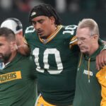 Sep 6, 2024; Sao Paulo, BRA; Green Bay Packers quarterback Jordan Love (10) is assisted off the field after an injury during the second half against the Philadelphia Eagles at Neo Quimica Arena.