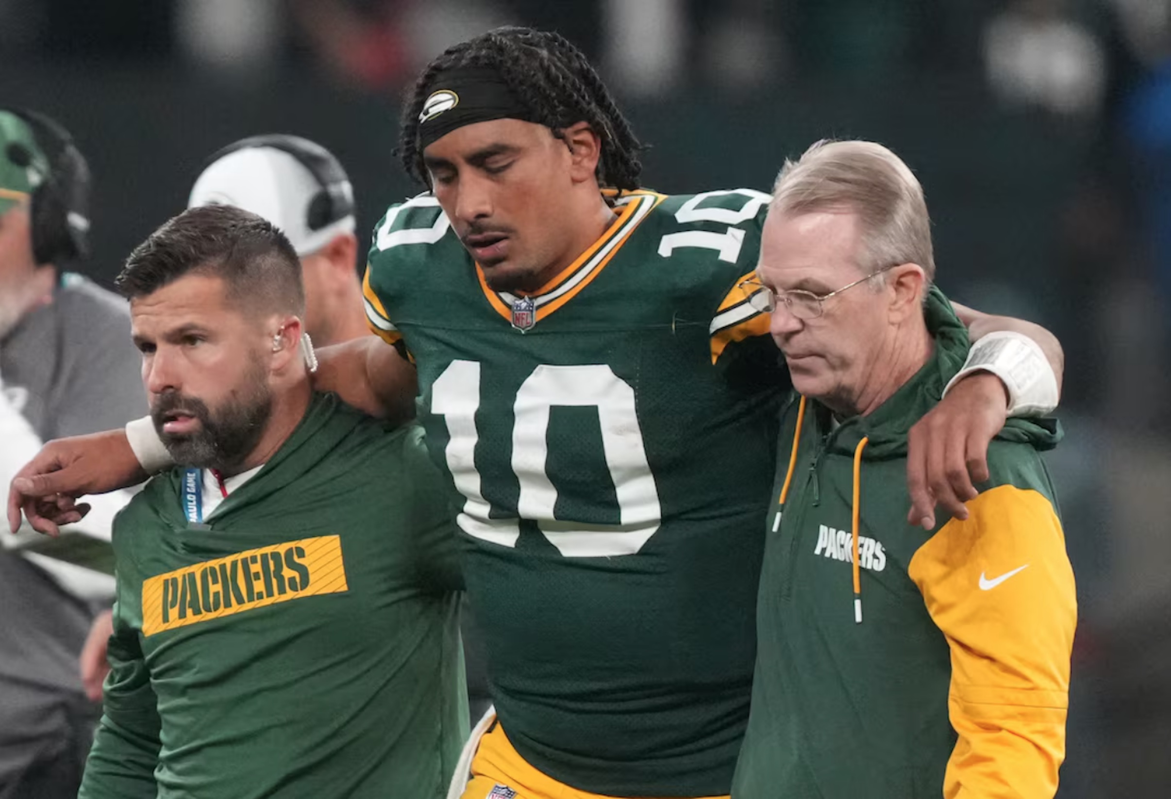 Sep 6, 2024; Sao Paulo, BRA; Green Bay Packers quarterback Jordan Love (10) is assisted off the field after an injury during the second half against the Philadelphia Eagles at Neo Quimica Arena. 