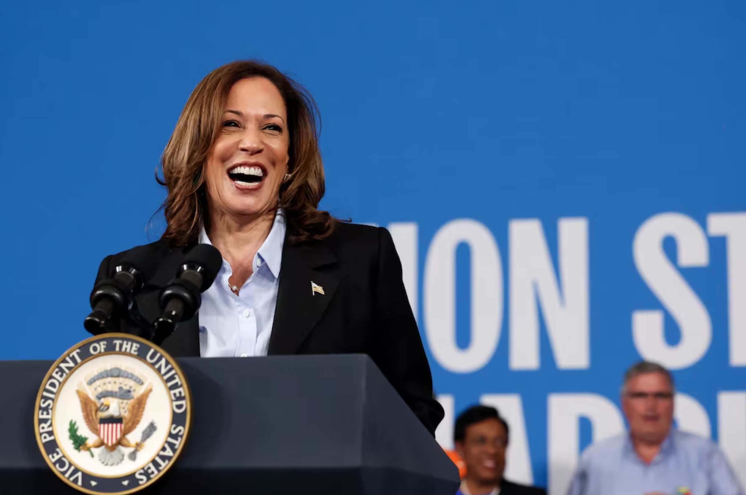 Democratic presidential nominee and U.S. Vice President Kamala Harris reacts as she speaks at North Western High School in Detroit, Michigan, U.S., September 2, 2024. REUTERS/Brendan McDermid