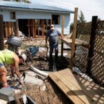 Leslie Merian and her husband David Hall survey the damage to their home and hotel after Hurricane Helene passed through the Florida panhandle, in Spring Warrior Fish Camp, Florida, U.S., September 28, 2024.