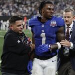 New York Giants wide receiver Malik Nabers (1) is helped off the field after an injury during the fourth quarter of an NFL football game against the Dallas Cowboys, Thursday, Sept. 26, 2024, in East Rutherford, N.J.