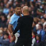 Soccer Football - Premier League - Manchester City v Arsenal - Etihad Stadium, Manchester, Britain - September 22, 2024 Manchester City's Rodri with manager Pep Guardiola after being substituted