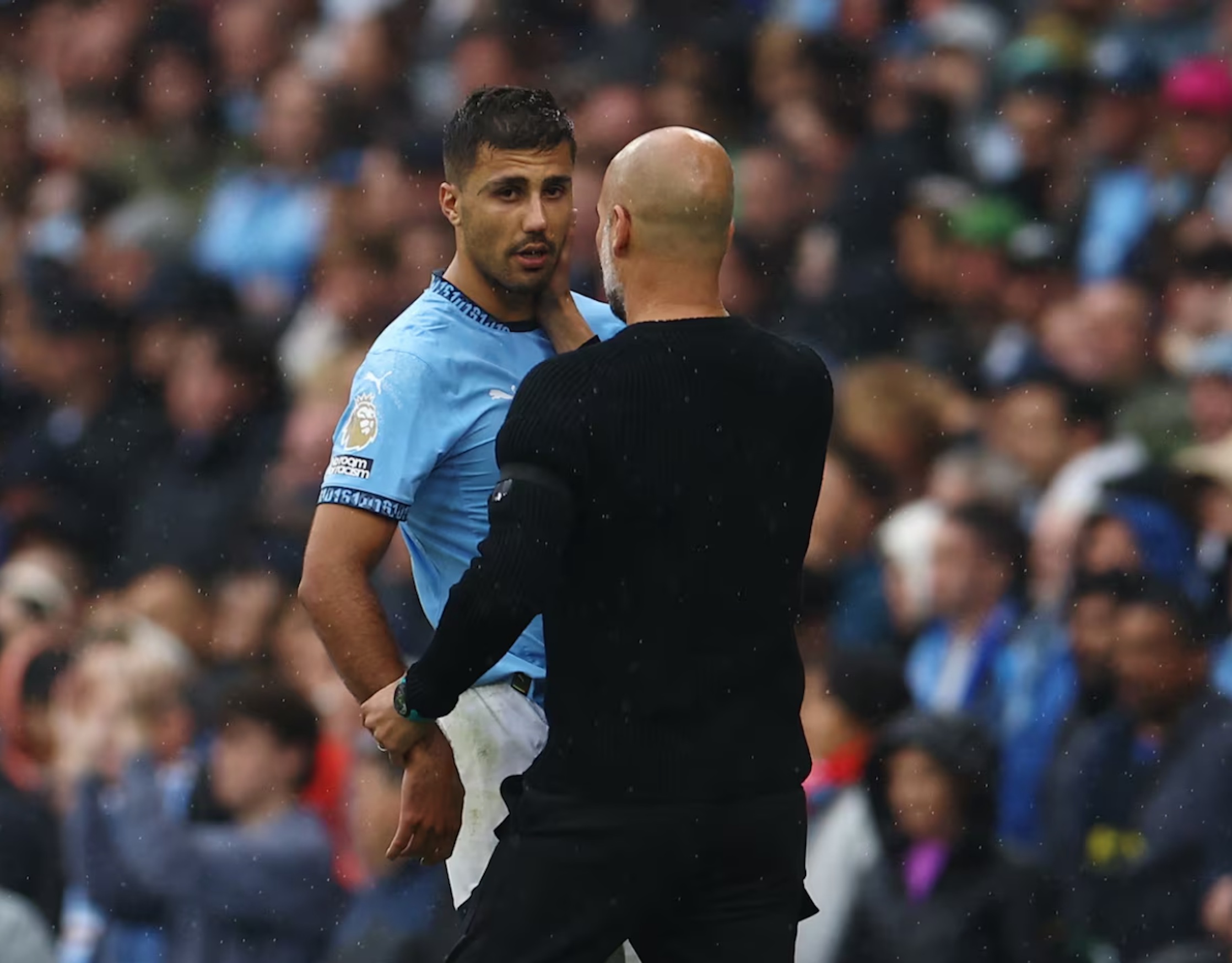 Soccer Football - Premier League - Manchester City v Arsenal - Etihad Stadium, Manchester, Britain - September 22, 2024 Manchester City's Rodri with manager Pep Guardiola after being substituted 