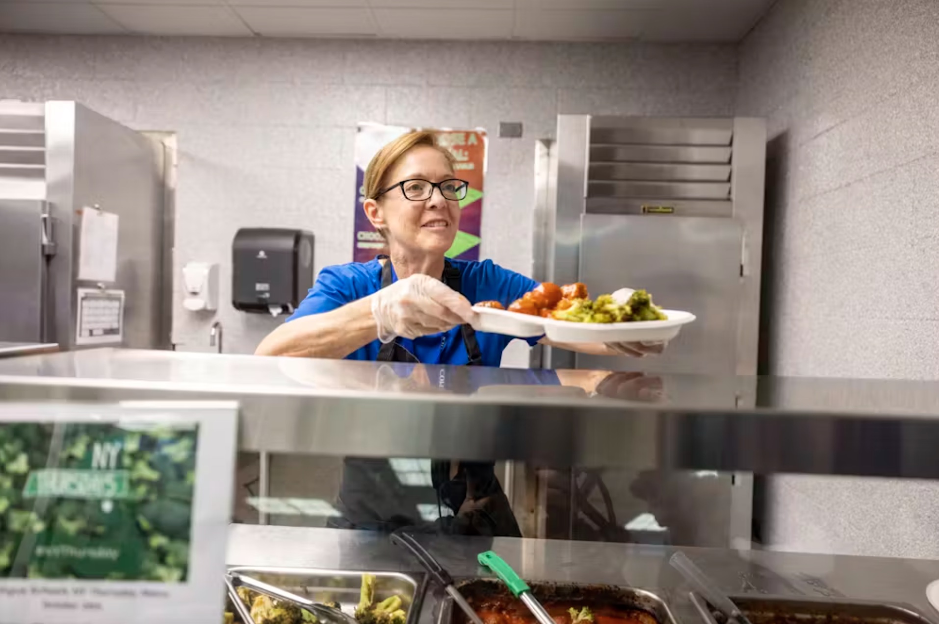 Students are served a lunch made with local farm produce at Copiague High School on New York’s Long Island on Oct. 20, 2022. 