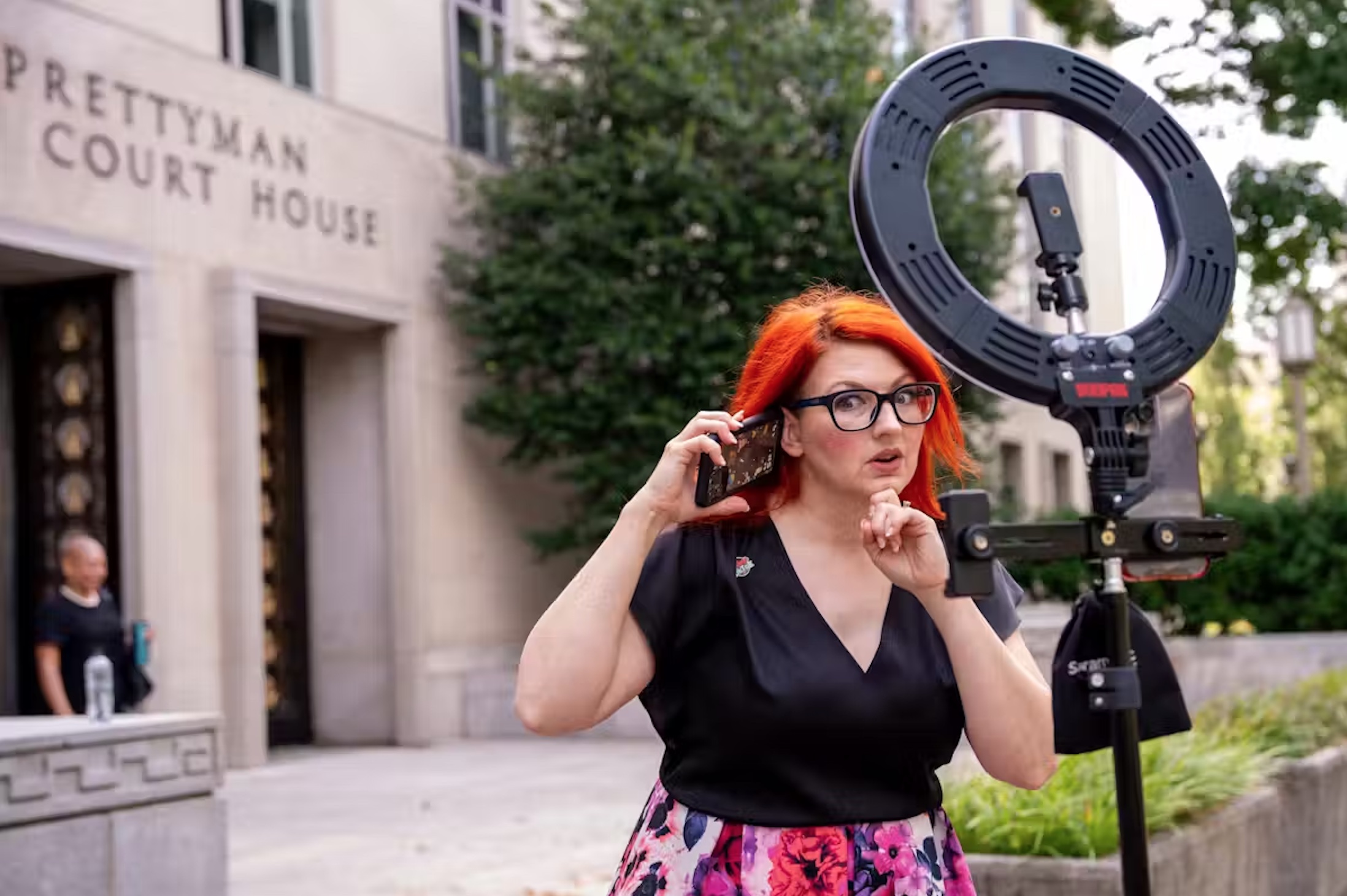 Tiffany Cianci, the host of ‘TikTok Townhall,’ livestreams outside the building that houses the U.S. Court of Appeals in Washington. 