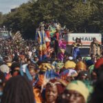 Revelers march at the intersection of Franklin Avenue and Eastern Parkway during the West Indian Day Parade on Monday, Sept. 2, 2024, in the Brooklyn borough of New York. (AP Photo/Andres Kudacki)