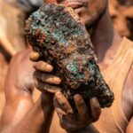 An artisanal miner holds a cobalt stone at the Shabara artisanal mine near Kolwezi.